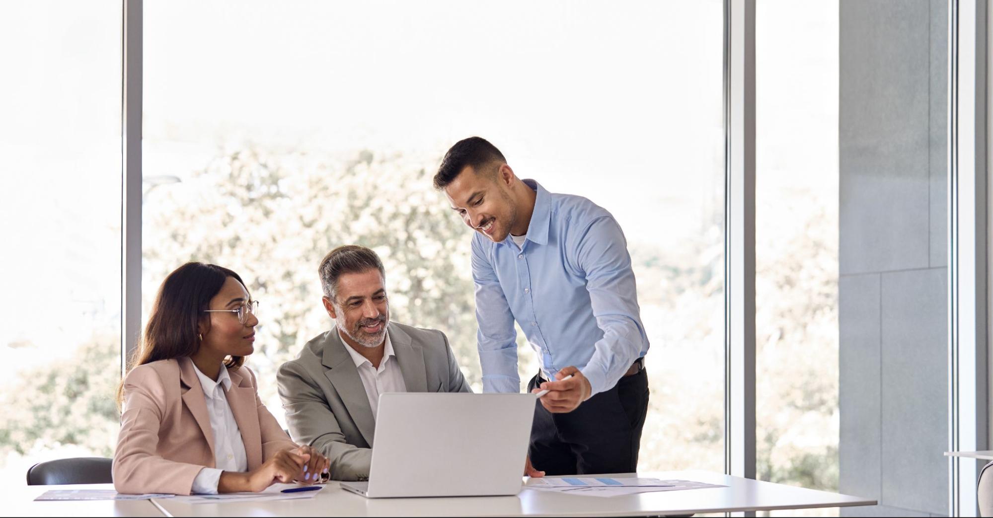 Commercial property owner and manager reviewing lease and financial strategy during a property management discussion