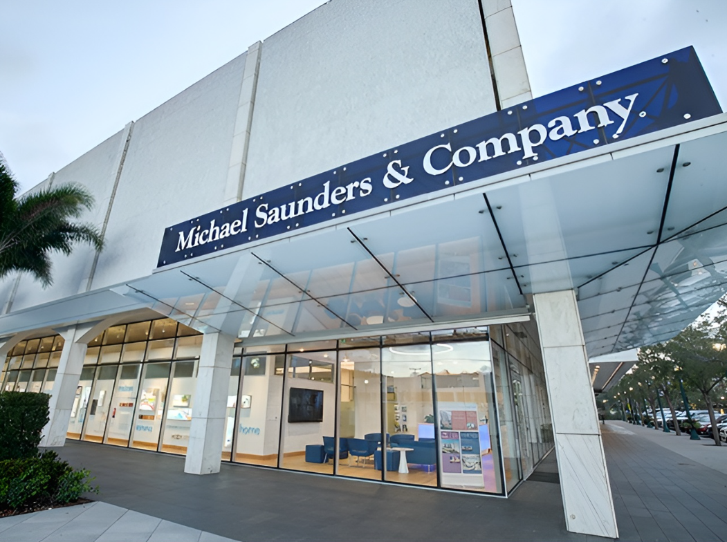 Exterior of a Michael Saunders & Company office with company signage above the glass entrance